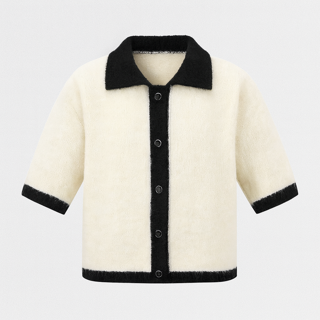 Beige short-sleeve knit shirt with black contrast trim on collar, cuffs, and placket.